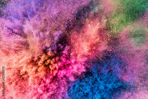 Colorful holi powder blowing up.