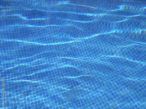 Distorted Blue Tile Texture under the Water in a Swimming Pool