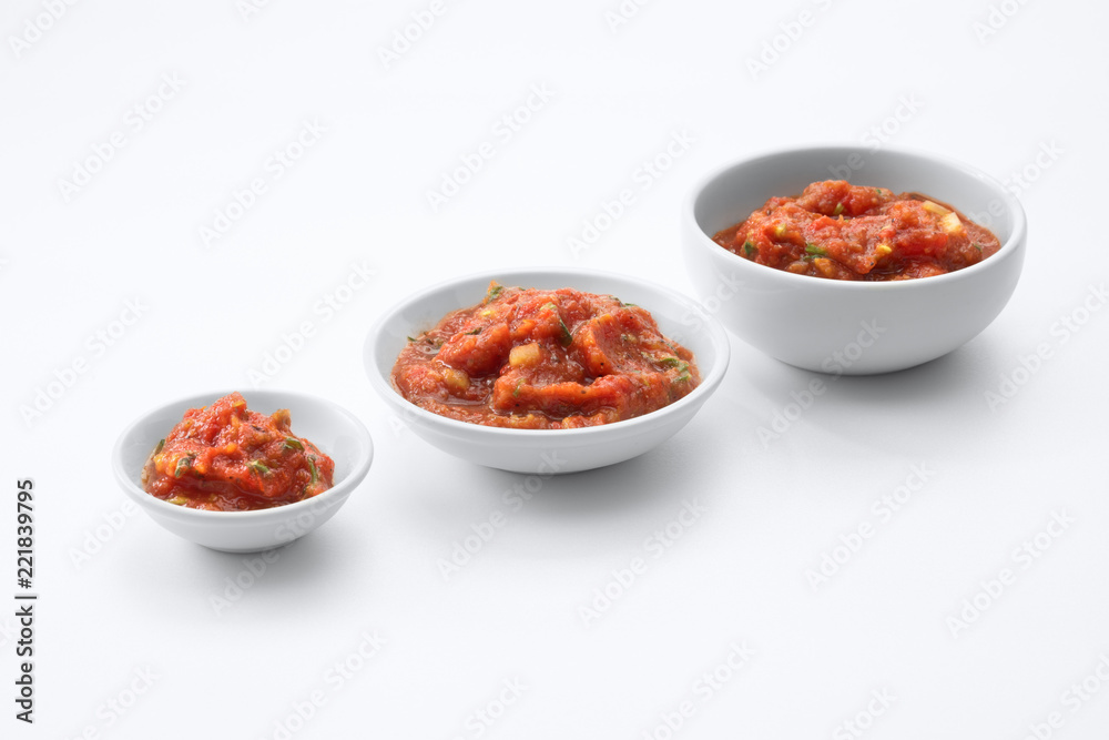 close up view of salsa hot spicy meixan sauce on white back close up view of salsa hot spicy meixan sauce on white back