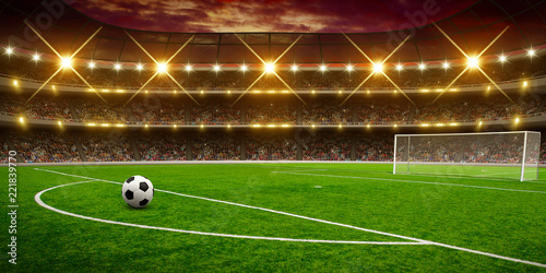 Soccer ball on green stadium
