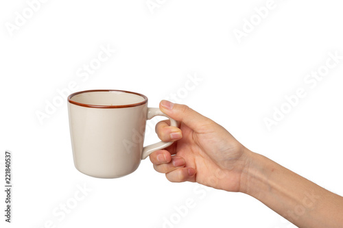 Female hand holding a cup of coffee isolated on white background.
