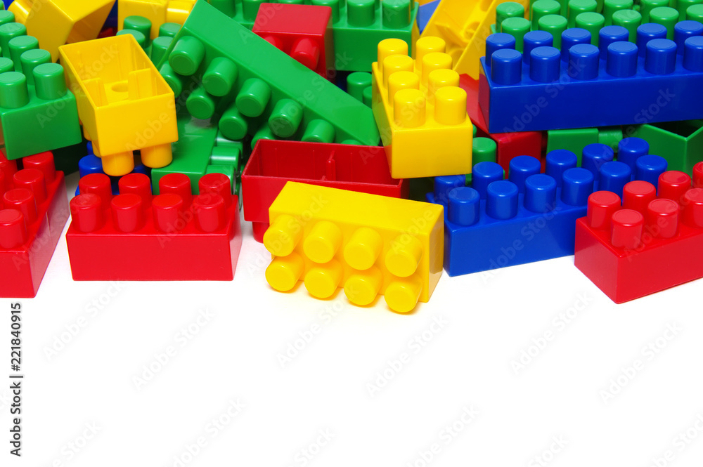 Fototapeta premium Plastic building blocks on white