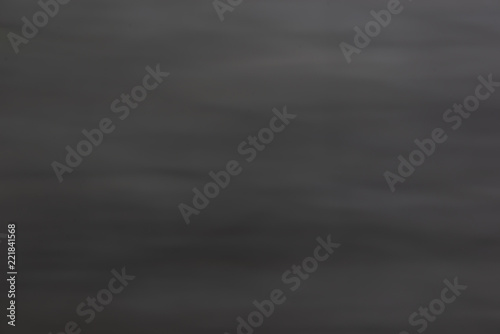 Abstract blurred dark grey background texture. Blank space for design