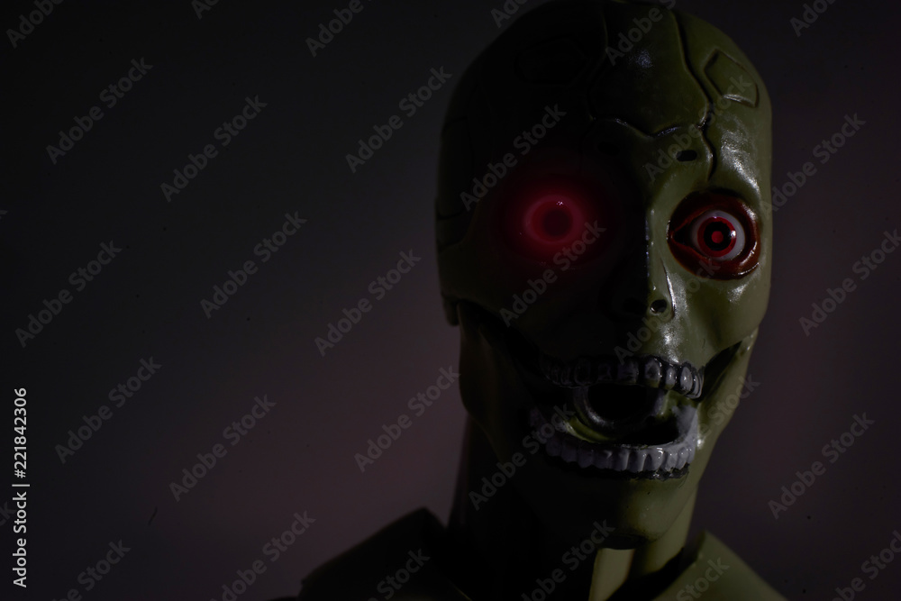 horror face of artificial robot with red eye in the dark foto de Stock |  Adobe Stock