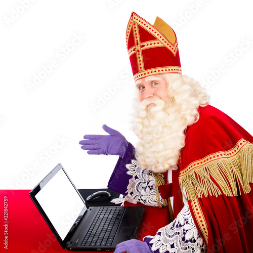 Sinterklaas with notebook or laptop photo