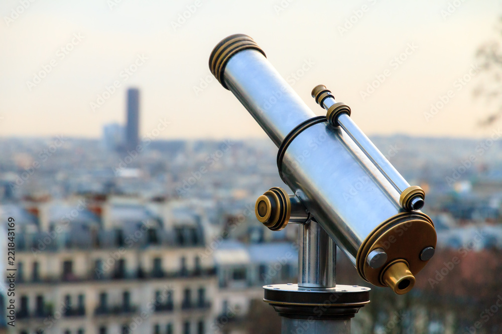 Telescope looking out over the skyline of Paris, France