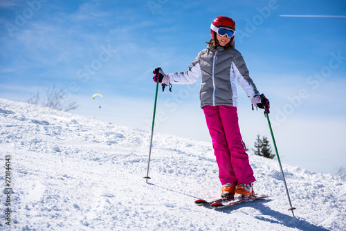 Happy little girl on the ski slopes