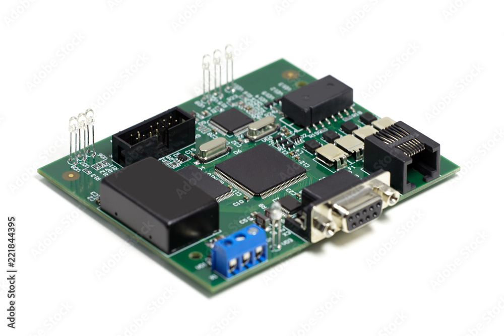 Electronic printed circuit board with chips and other components, green color, front side, angled view, isolated on white background Electronic printed circuit board with chips and other components, green color, front side, angled view, isolated on white background
