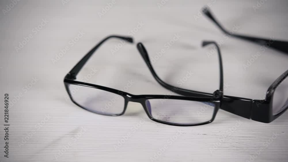 Front view of reading glasses on white table. Front view of reading glasses on white table.