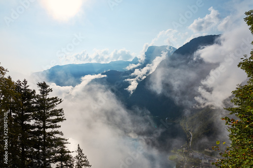 View of the mountains, forest and blue sky with clouds at the village and Lake Hallstatt