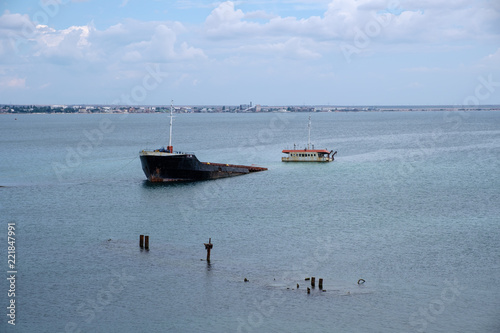 shipwreck or sunken ship abandoned on sea bay