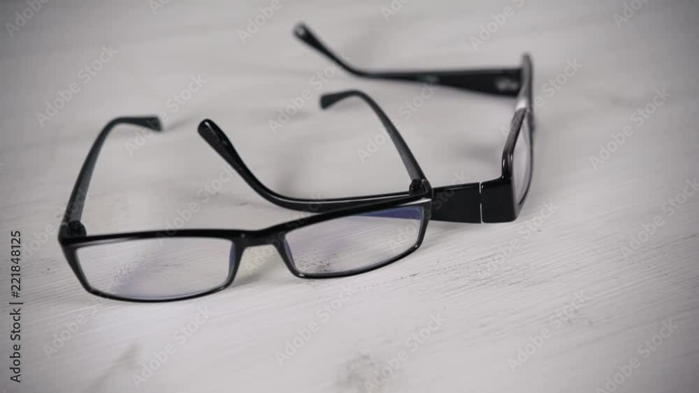 Front view of reading glasses on white table. Front view of reading glasses on white table.