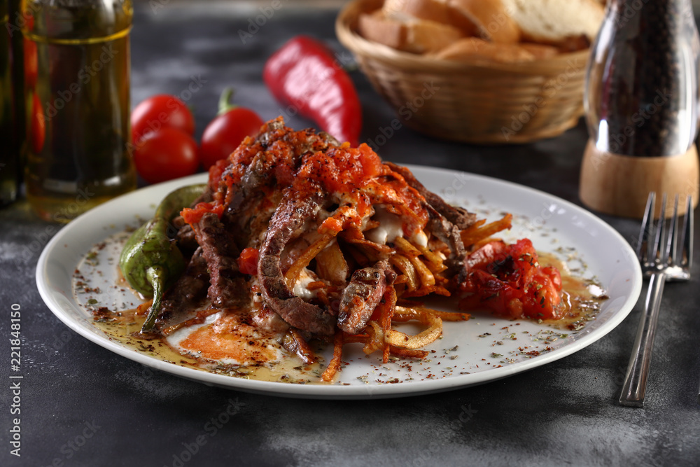 steak slices with tomato sauces and onion and yoghurt on a wooden background steak slices with tomato sauces and onion and yoghurt on a wooden background