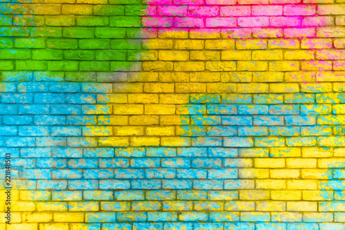Colorful painted brick wall texture background. Graffiti brick wall, colorful background.