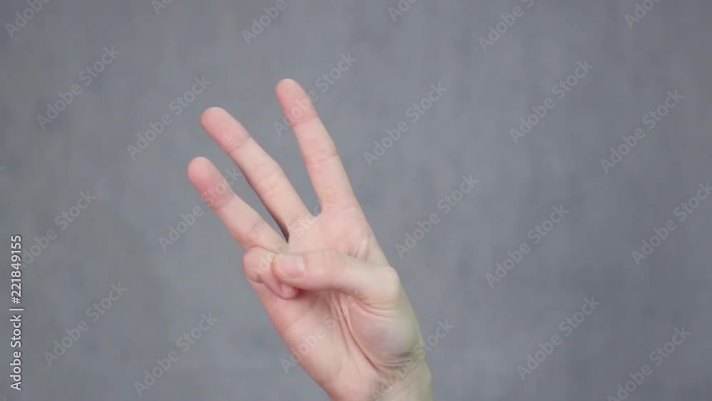 Woman hand gesturing number three. Gesture sign symbol. Communication with no talking concept Woman hand gesturing number three. Gesture sign symbol. Communication with no talking concept