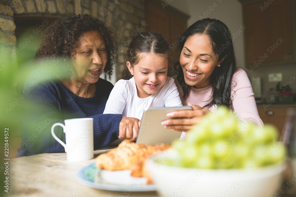 Family using digital tablet at home Family using digital tablet at home