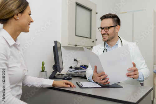Handsome doctor is talking ...