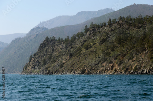 Picturesque rocky coast of Lake Baikal. View from water
