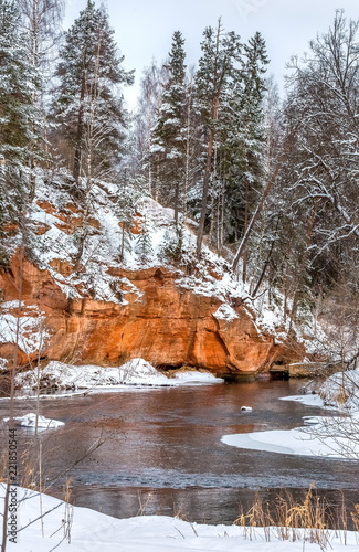 Red river bank. Geological exposure of the Devonian on the Oredezh River, in the north of Russia. photo