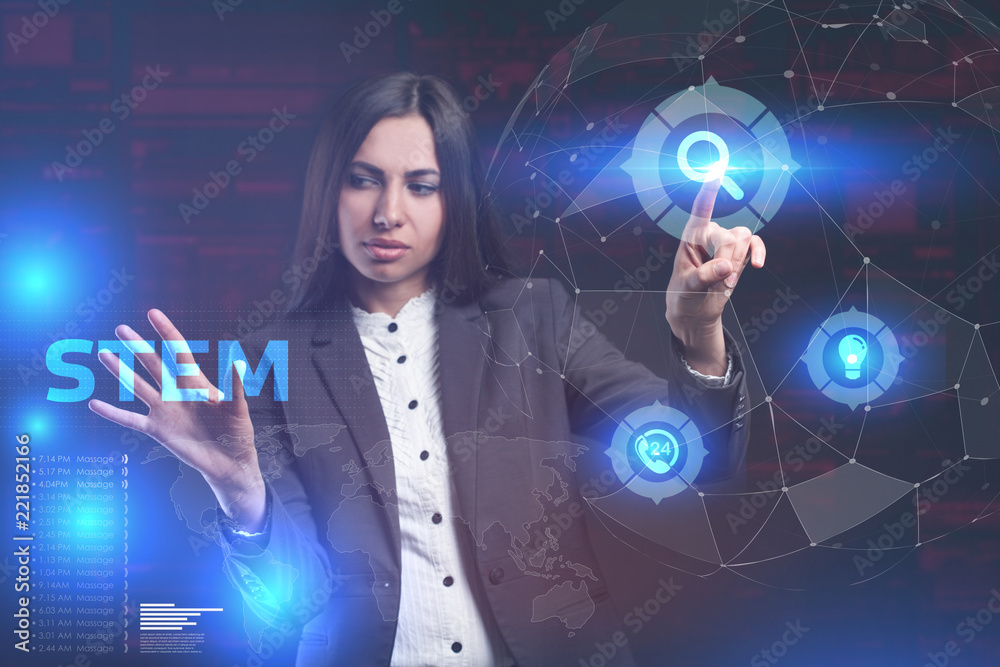 The concept of business, technology, the Internet and the network. A young entrepreneur working on a virtual screen of the future and sees the inscription: STEM The concept of business, technology, the Internet and the network. A young entrepreneur working on a virtual screen of the future and sees the inscription: STEM