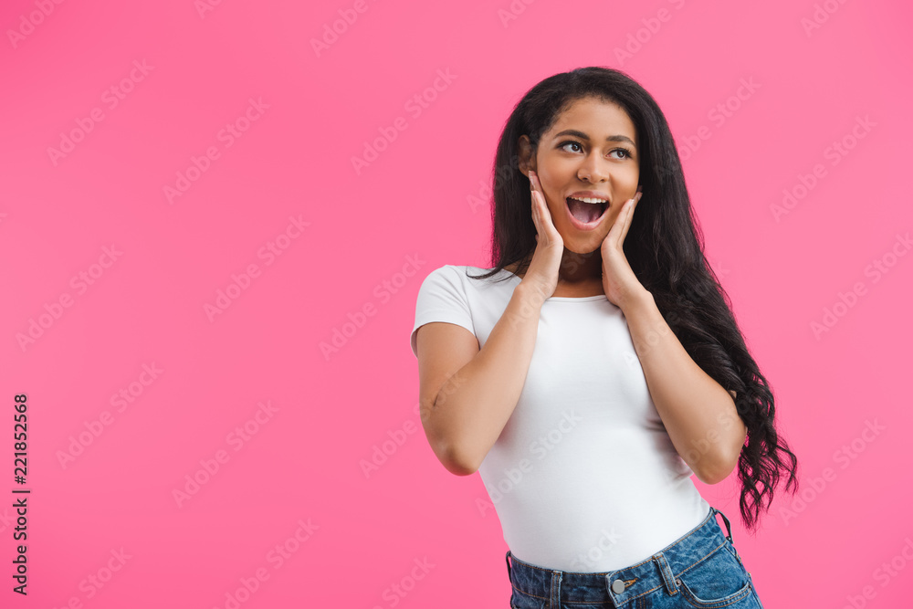 portrait of excited young african american woman in casual clothing isolated on pink portrait of excited young african american woman in casual clothing isolated on pink
