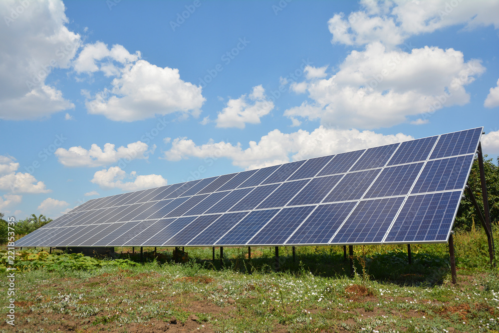 Solar panels with beautiful clouds sky. Solar panels for green energy.