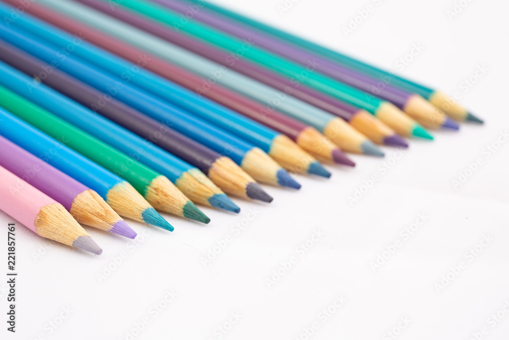 Cool Shades of colored pencils at an angle against white background Cool Shades of colored pencils at an angle against white background