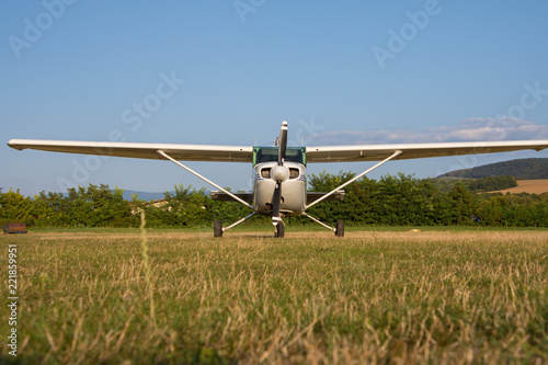 small airplane with a propeller at the airport