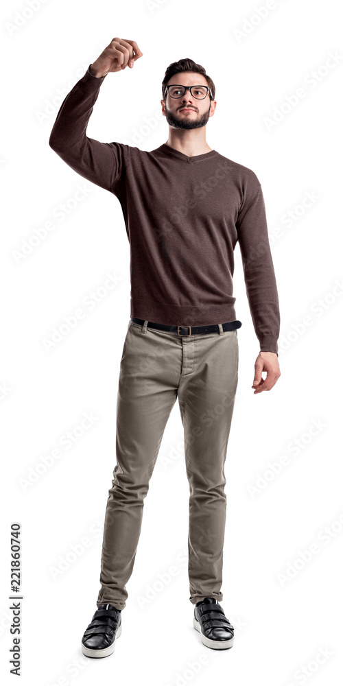 A bearded man in smart casual clothes looks side up with his arms folded on his chest. A bearded man in smart casual clothes looks side up with his arms folded on his chest.