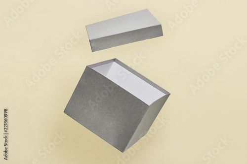 grey surpirse box floating in a yellow background mockup