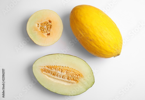 Flat lay composition with melons on white background