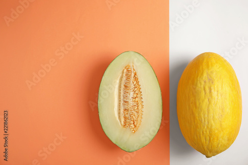 Flat lay composition with melons and space for text on color background