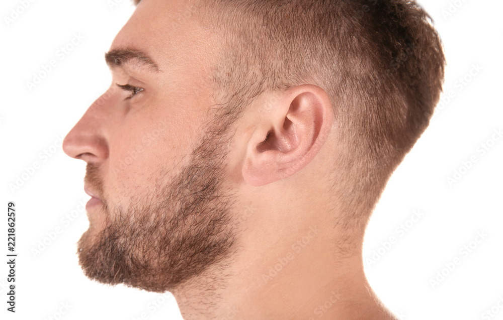 Young man on white background, closeup. Hearing problem Young man on white background, closeup. Hearing problem