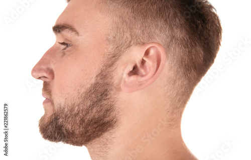 Young man on white background, closeup. Hearing problem