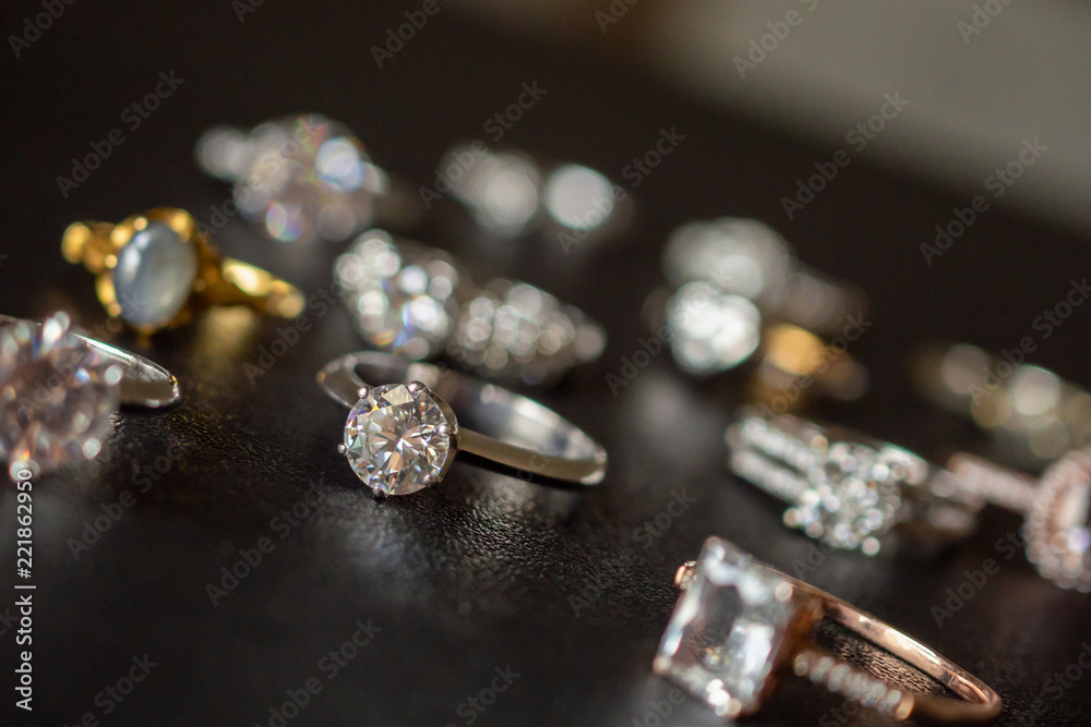 Jewelry diamond rings set on black background close up Jewelry diamond rings set on black background close up