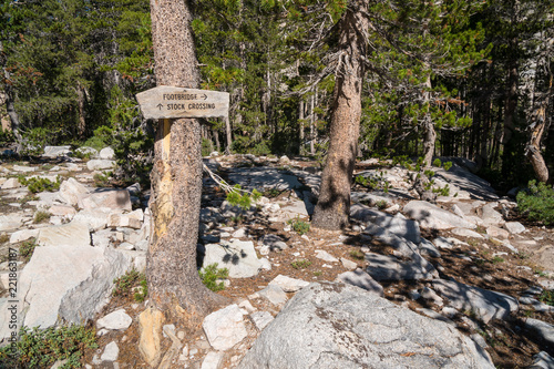 Wooden trail signs in the mountain backcountry of the Sierra Nevada in California