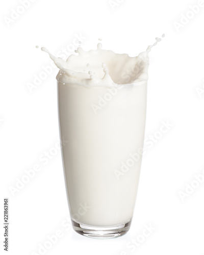 Milk splashing out of glass isolated on white background.