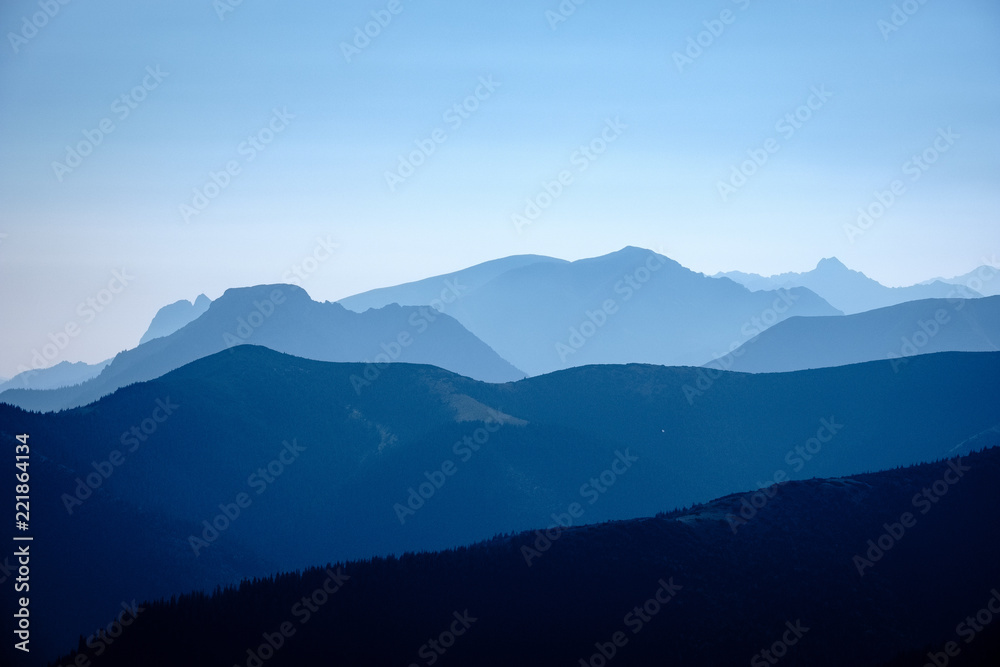 mountain top panorama in  autumn covered in mist or clouds