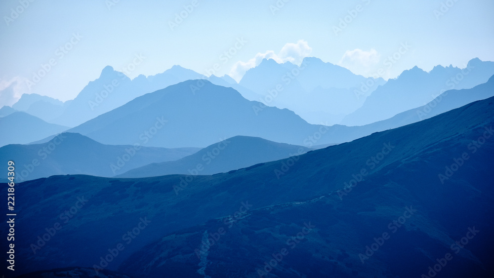 mountain top panorama in  autumn covered in mist or clouds