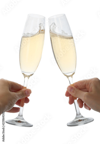 Women toasting with glasses of champagne on white background
