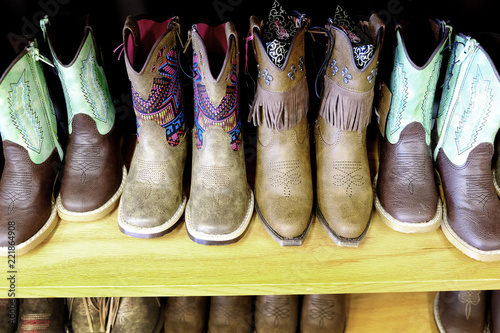 Colorful Cowboy Boots on Shelf Fashion Shoes