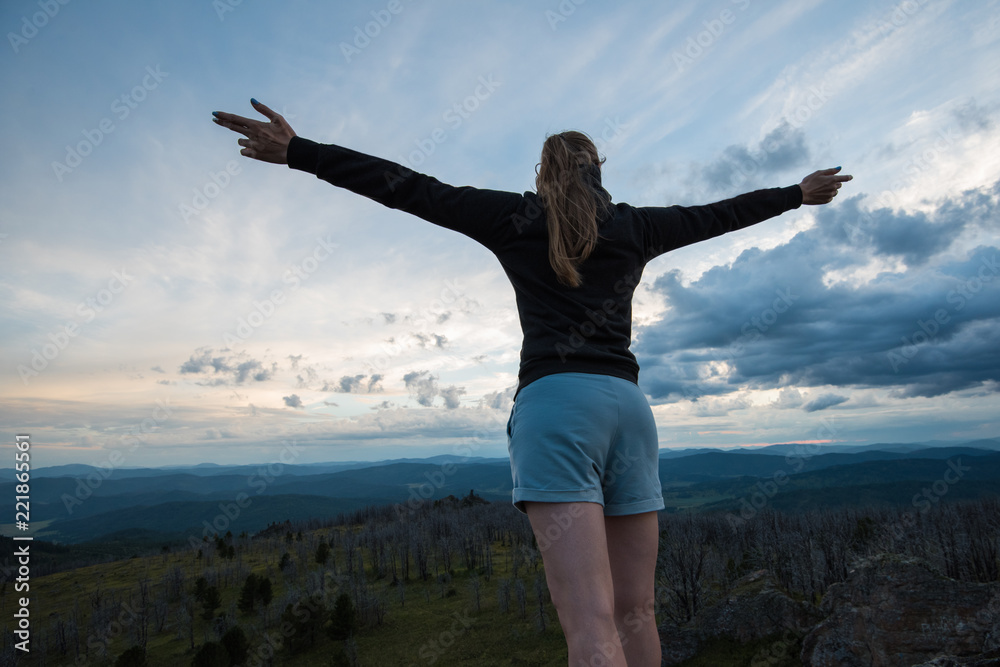 Travel, lesure and freedom concept - woman on the top of Altai mountain, beauty summer evening landcape Travel, lesure and freedom concept - woman on the top of Altai mountain, beauty summer evening landcape