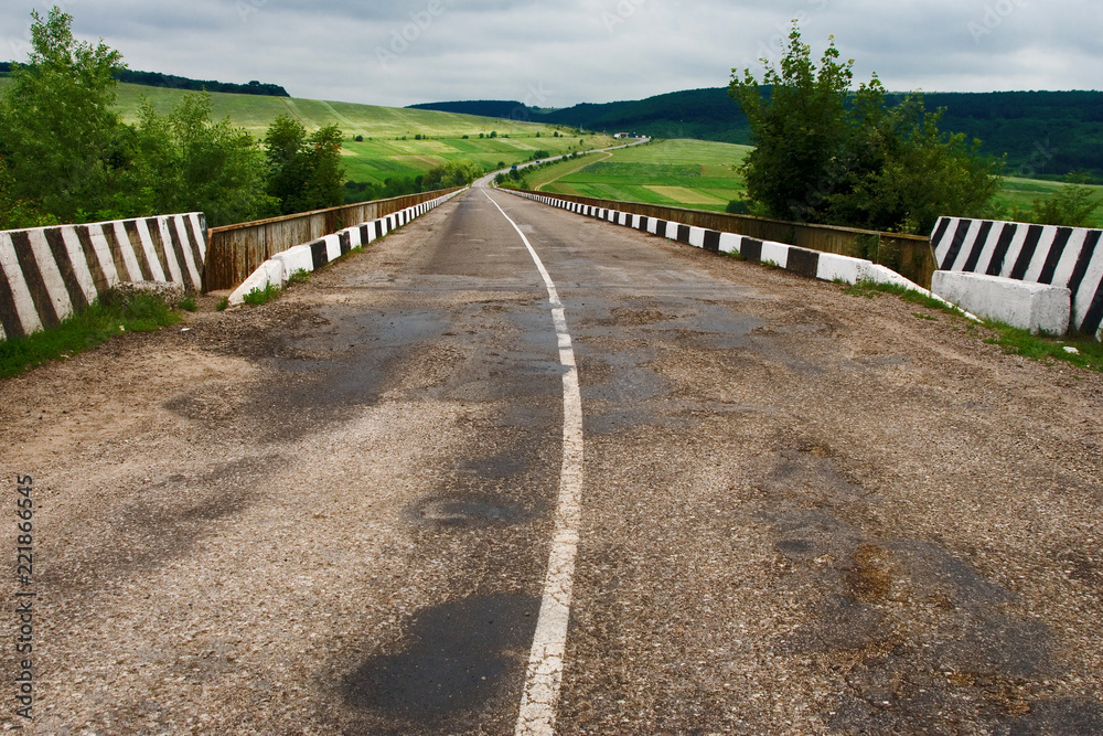 Asphalt road through the bridge. Ukraine
