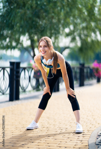 Woman in fit wear tired, during morning jogging