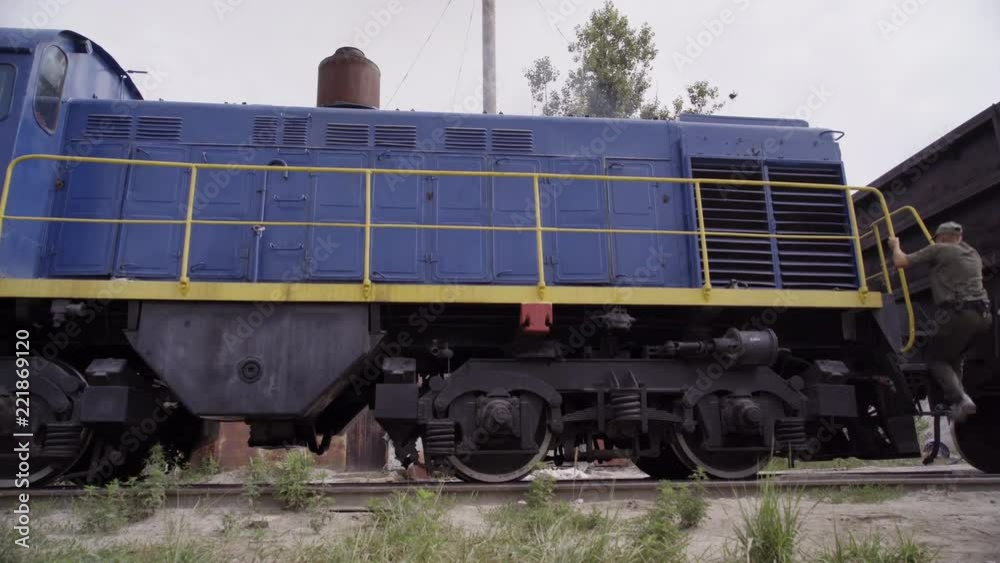 Mechanic checks a train. check and repair of break system of the locomotive. Mechanic checks a train. check and repair of break system of the locomotive.