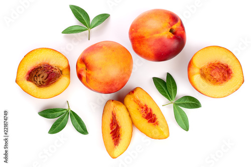 ripe nectarine with leaves isolated on white background. Top view. Flat lay pattern