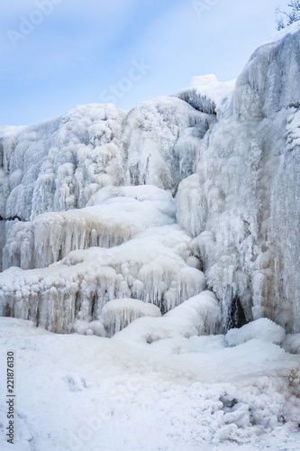 Frozen cascade of waterfall. Winter background. Jagala Waterfall, Estonia. Soft focus.