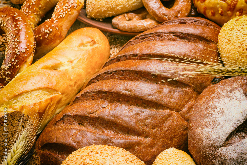 Fresh bread and bakery in the form of background, close-up and with selective focus