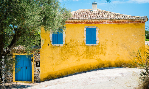 Blue-yellow village Greek cottage