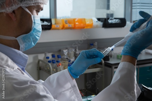Female scientist experimenting in laboratory